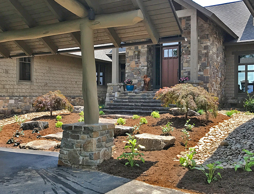 A home with a stone walkway and landscaping.