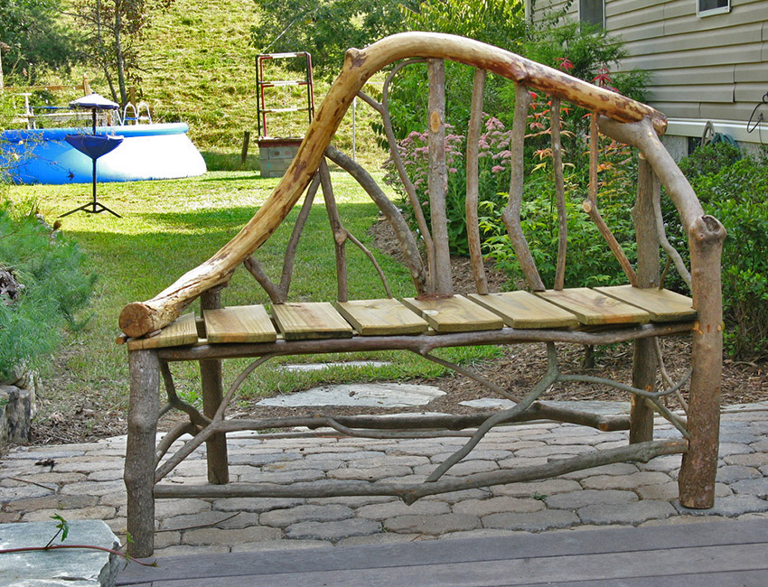 A wooden bench made out of branches.